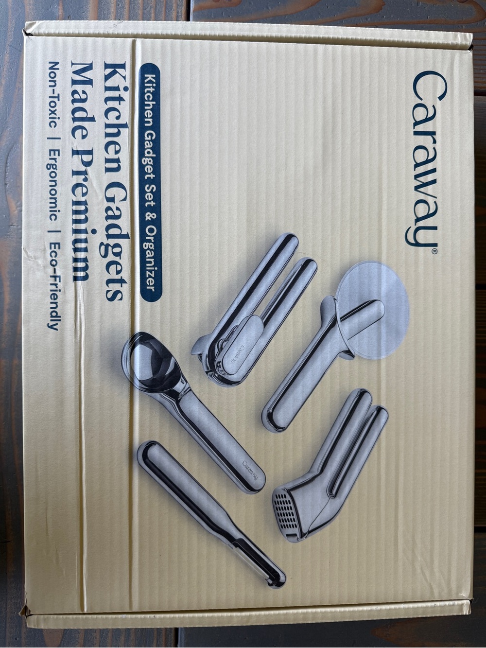 Caraway Stainless Steel Kitchen Gadget Set and wood organizer.